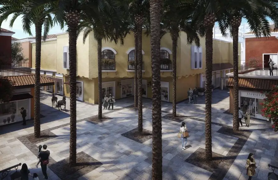 Courtyard in a retail development featuring trees, Courtyard facing retail, food and beverage, and shoppers